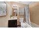 Cozy bathroom with tiled shower, vanity, and storage at 87 Elmgreen Ln, Evergreen, CO 80439
