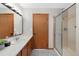 Bathroom with sink, vanity, and glass-door shower at 87 Elmgreen Ln, Evergreen, CO 80439