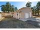 Spacious detached two-car garage with side door and paved driveway at 87 Elmgreen Ln, Evergreen, CO 80439