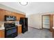 Bright kitchen with black appliances, ample cabinet space, and tile flooring at 87 Elmgreen Ln, Evergreen, CO 80439