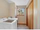 Functional laundry room with modern washer and dryer, a window, and storage space at 87 Elmgreen Ln, Evergreen, CO 80439
