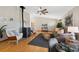 Cozy living room with a wood-burning stove, comfortable seating, and stylish decor at 87 Elmgreen Ln, Evergreen, CO 80439