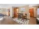 Bright living room featuring wood floors and adjacent eating area at 87 Elmgreen Ln, Evergreen, CO 80439