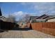 Property includes gravel alleyway and wooden fence at 9121 Harlequin Cir, Frederick, CO 80504