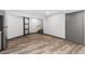Spacious basement features modern barn door, recessed lighting, and laminate flooring at 9121 Harlequin Cir, Frederick, CO 80504