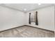 Cozy finished basement featuring soft carpeting, neutral walls, and a window for natural light at 9121 Harlequin Cir, Frederick, CO 80504
