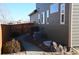 Exterior view showing the side of the home, side yard, fencing, and equipment at 9121 Harlequin Cir, Frederick, CO 80504