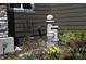 Beautiful backyard landscaping features a decorative fountain surrounded by colorful flowers and lush greenery at 9121 Harlequin Cir, Frederick, CO 80504
