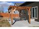Outdoor pergola with wooden frame, providing shade over the patio area and enhancing the backyard space at 9121 Harlequin Cir, Frederick, CO 80504