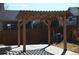 String lights accent the wood pergola over the backyard patio at 9121 Harlequin Cir, Frederick, CO 80504