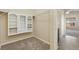 Carpeted walk-in closet provides ample storage space with built-in shelving units and hanging rods at 9121 Harlequin Cir, Frederick, CO 80504