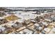Aerial view of neighborhood showing homes and open space. Some snow on the ground at 9121 Harlequin Cir, Frederick, CO 80504