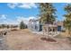 Expansive backyard featuring a well-kept lawn, patio with pergola, and attractive wooden fence at 510 W Prestwick Way, Castle Rock, CO 80104