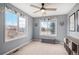 Cozy bedroom with light gray walls, plenty of natural light, and playful decor for a cheerful atmosphere at 510 W Prestwick Way, Castle Rock, CO 80104