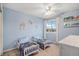 Charming bedroom with two twin beds, light blue walls, and bright natural light at 510 W Prestwick Way, Castle Rock, CO 80104