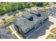 An aerial view showcases the townhome's gray roof, brick accents, and private driveway at 5179 S Fairplay St, Aurora, CO 80015