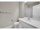 Bathroom with white cabinets, tile floor and shower, and modern fixtures at 5179 S Fairplay St, Aurora, CO 80015