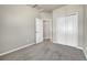 Bedroom with closet featuring neutral colored walls and carpet flooring at 5179 S Fairplay St, Aurora, CO 80015