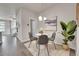 Cozy dining area with a round table, four chairs, stylish decor, and natural light at 5179 S Fairplay St, Aurora, CO 80015