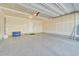 Attached garage with epoxy flooring and open space at 5179 S Fairplay St, Aurora, CO 80015