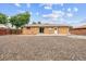 Exterior backyard with a small patio with ample space for customization and privacy fence at 8460 Corona St, Denver, CO 80229