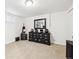 Spacious bedroom featuring neutral tones, a dresser and a window with natural light at 8460 Corona St, Denver, CO 80229