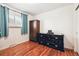 Spare bedroom with closet, dresser and wood floors at 8460 Corona St, Denver, CO 80229
