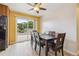 Bright dining room with stylish table set and sliding door with view of the backyard at 8460 Corona St, Denver, CO 80229