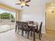 Bright dining room with stylish table set and sliding door with view of the backyard at 8460 Corona St, Denver, CO 80229