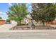 Ranch-style home with brick front, mature trees, and a well-manicured, drought-tolerant front yard at 8460 Corona St, Denver, CO 80229
