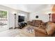 Bright living room with neutral paint, wood floors and natural light at 8460 Corona St, Denver, CO 80229
