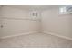 Finished basement with neutral carpet, natural light, and a blank canvas for endless possibilities at 3055 Clermont St, Denver, CO 80207