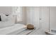 Inviting bedroom with a soft blanket, and view of a closet at 3055 Clermont St, Denver, CO 80207