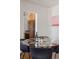 Bright dining area featuring a glass table and modern decor, adjacent to the kitchen at 3055 Clermont St, Denver, CO 80207