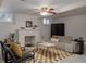 Cozy living room with a decorative fireplace, stylish rug, and comfortable seating, perfect for relaxing and entertaining guests at 3055 Clermont St, Denver, CO 80207