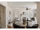 Open-concept home features a dining area connected to a cozy living space and decorative fireplace at 3055 Clermont St, Denver, CO 80207