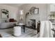 Inviting living room boasts a decorative fireplace, soft lighting, and a comfortable seating area at 3055 Clermont St, Denver, CO 80207