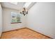 Bright dining area features laminate floors, neutral paint, skylights and modern lighting at 11908 W Aqueduct Dr, Littleton, CO 80127