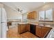 Bright kitchen features modern appliances, wood cabinets, and plenty of natural light at 11908 W Aqueduct Dr, Littleton, CO 80127
