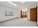 Spacious main bedroom with skylights flows into an en-suite bathroom at 11908 W Aqueduct Dr, Littleton, CO 80127