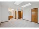 Large main bedroom with skylights has attached bath and closet spaces at 11908 W Aqueduct Dr, Littleton, CO 80127