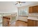 Bright area with wooden staircase and a window overlooking the yard at 11908 W Aqueduct Dr, Littleton, CO 80127