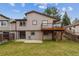This home features a backyard with a grass lawn, cement patio and a balcony at 444 S Larkspur Dr, Castle Rock, CO 80104
