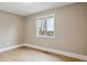 Bedroom with hardwood floors, baseboard trim and fresh neutral paint at 444 S Larkspur Dr, Castle Rock, CO 80104
