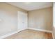 Bedroom featuring double doors, hardwood floors, and neutral color palette at 444 S Larkspur Dr, Castle Rock, CO 80104