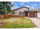 Charming single-Gathering home with brick accents, attached garage, and a well-maintained front yard at 444 S Larkspur Dr, Castle Rock, CO 80104