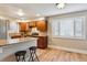 Bright kitchen featuring wooden cabinets, granite countertops, and a functional breakfast bar at 444 S Larkspur Dr, Castle Rock, CO 80104