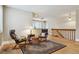 Inviting living room with hardwood floors, a large window, and stylish furnishings at 444 S Larkspur Dr, Castle Rock, CO 80104