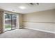Cozy living room featuring soft carpet, sliding doors, and lots of natural light at 444 S Larkspur Dr, Castle Rock, CO 80104