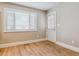 Bright room featuring a large window, light hardwood floors, and access to an outdoor space at 444 S Larkspur Dr, Castle Rock, CO 80104